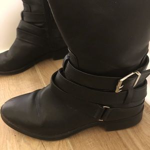 Black knee-high vegan leather strappy boots. Gently used size 7 1/2